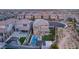 Aerial view of a home featuring a backyard with a pool, hot tub, and outdoor kitchen at 389 Red Feather Peak Ct, Las Vegas, NV 89138