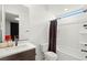 Modern bathroom features a toilet, vanity, shower, and dark brown accents at 389 Red Feather Peak Ct, Las Vegas, NV 89138