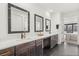 Beautiful bathroom with a long dark vanity, double sinks, and modern fixtures at 389 Red Feather Peak Ct, Las Vegas, NV 89138
