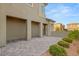 Spacious three car garage with paved driveway and manicured landscaping at 389 Red Feather Peak Ct, Las Vegas, NV 89138