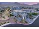 Charming home with desert landscaping, a paved driveway, and mountain views at 389 Red Feather Peak Ct, Las Vegas, NV 89138