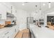 Modern kitchen features white cabinets, stainless steel appliances, and a stylish backsplash at 389 Red Feather Peak Ct, Las Vegas, NV 89138