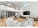 Spacious living room featuring high ceilings, backyard access, and a contemporary media center at 389 Red Feather Peak Ct, Las Vegas, NV 89138