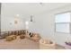 Spacious playroom featuring a cozy sofa, assorted toys, and natural light at 389 Red Feather Peak Ct, Las Vegas, NV 89138