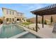 Inviting pool area with an outdoor kitchen and spacious patio perfect for entertaining at 389 Red Feather Peak Ct, Las Vegas, NV 89138