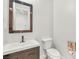 Tastefully designed powder room with a modern vanity, square undermount sink, toilet, and contemporary fixtures at 389 Red Feather Peak Ct, Las Vegas, NV 89138