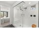 Beautiful glass walk-in shower features white subway tile, modern fixtures, and a shower bench at 389 Red Feather Peak Ct, Las Vegas, NV 89138