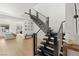 Modern staircase with horizontal metal railings and wood treads leading to the upper level, adding architectural interest at 389 Red Feather Peak Ct, Las Vegas, NV 89138