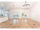 Dining room features tile floors, neutral paint, modern light fixture, and french door access to outdoors at 4014 Trapani Pl, Las Vegas, NV 89141