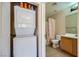 Efficient bathroom layout with stacked washer/dryer and tub shower at 43 E Agate Ave # 302, Las Vegas, NV 89123