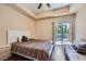 Bedroom with hardwood floors, sliding glass door, and modern ceiling fan at 43 E Agate Ave # 302, Las Vegas, NV 89123