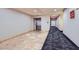 Hallway with elevators and directional signage for units at 43 E Agate Ave # 302, Las Vegas, NV 89123
