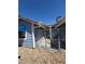 A charming backyard with an iron gate and stone landscaping, providing privacy and curb appeal at 5420 Centurion Ct # 104, Las Vegas, NV 89122