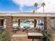 Outdoor kitchen and dining area with grill, tables, and seating, perfect for community gatherings at 5420 Centurion Ct # 104, Las Vegas, NV 89122