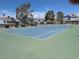 Enjoy a friendly match on the community's well-maintained tennis court with trees and landscaping at 5420 Centurion Ct # 104, Las Vegas, NV 89122