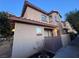 Charming two-story townhouse featuring stucco siding, a tile roof, and well-maintained landscaping at 558 Roxella Ln # D, Las Vegas, NV 89110
