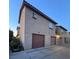 Two-story townhouse with individual one-car garages and convenient driveway access at 558 Roxella Ln # D, Las Vegas, NV 89110