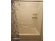 Bathroom shower tub combo with tile surround at 5651 Bettors Luck Ct, Las Vegas, NV 89122