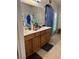 Double sink bathroom vanity with updated faucets and shower at 5651 Bettors Luck Ct, Las Vegas, NV 89122