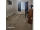Bedroom with dark curtains and carpeted floor at 5651 Bettors Luck Ct, Las Vegas, NV 89122