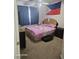 Bedroom with a ceiling fan and window at 5651 Bettors Luck Ct, Las Vegas, NV 89122