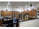 This is the kitchen featuring wooden cabinets, tile floors and stainless steel appliances at 5651 Bettors Luck Ct, Las Vegas, NV 89122
