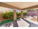 Covered patio with brick flooring that overlooks a landscaped backyard with multiple seating areas at 5735 Oak Bend Dr, Las Vegas, NV 89135