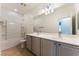 Clean bathroom with a shower over tub and double sink vanity at 5735 Oak Bend Dr, Las Vegas, NV 89135