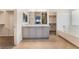 Luxurious bathroom with dual sink vanity, ample storage, and separate tub and walk-in shower at 5735 Oak Bend Dr, Las Vegas, NV 89135