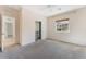 Neutral bedroom with carpeted floors, window, and walk-in closet at 5735 Oak Bend Dr, Las Vegas, NV 89135