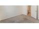 This bedroom boasts neutral carpeting, a ensuite bathroom, and ample natural light at 5735 Oak Bend Dr, Las Vegas, NV 89135