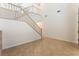 Bright entryway boasts tile flooring, high ceilings, and a staircase leading to the second floor at 5735 Oak Bend Dr, Las Vegas, NV 89135