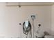 Garage featuring the electrical vehicle charger and automated sprinkler control at 5735 Oak Bend Dr, Las Vegas, NV 89135