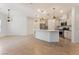 Bright, open kitchen with a large island, stainless steel appliances, and elegant pendant lighting at 5735 Oak Bend Dr, Las Vegas, NV 89135