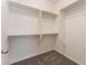 Empty walk-in closet with carpeted floors, white walls, and built-in shelving and hanging rods at 5735 Oak Bend Dr, Las Vegas, NV 89135