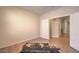 Bedroom featuring tile floors, baseboard trim, and an open doorway leading to the hallway at 5889 Wildhorse Ledge Ave, Las Vegas, NV 89131