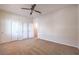 Bedroom with neutral carpet, three closets, and ceiling fan at 5889 Wildhorse Ledge Ave, Las Vegas, NV 89131
