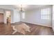 Bright living room featuring hardwood floors, a chandelier, and neutral wall paint at 5889 Wildhorse Ledge Ave, Las Vegas, NV 89131