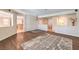 Open-concept living space boasts hardwood floors, neutral walls, and seamless flow to other areas at 5889 Wildhorse Ledge Ave, Las Vegas, NV 89131