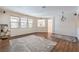 Spacious living room features hardwood floors, large windows, and elegant decor for a comfortable feel at 5889 Wildhorse Ledge Ave, Las Vegas, NV 89131