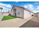 Home's backyard has an artificial lawn, gravel yard, and a block wall at 632 Hitchen Post Dr, Henderson, NV 89011