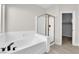 Bathroom featuring a soaking tub, separate shower, and modern fixtures at 632 Hitchen Post Dr, Henderson, NV 89011