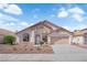 Charming single-story home featuring a neutral color palette and a well-maintained front yard at 632 Hitchen Post Dr, Henderson, NV 89011
