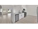 Open kitchen with stainless steel appliances, a center island, and backyard access at 632 Hitchen Post Dr, Henderson, NV 89011