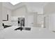 Modern kitchen featuring white cabinets, stainless steel appliances, and quartz countertops at 632 Hitchen Post Dr, Henderson, NV 89011