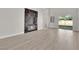 Bright living room with a modern fireplace, sliding glass door, and views of the backyard at 632 Hitchen Post Dr, Henderson, NV 89011