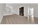 Spacious living room showcasing a stone fireplace, light wood flooring, and a modern design at 632 Hitchen Post Dr, Henderson, NV 89011
