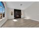 Bright living room with fireplace and large windows at 632 Hitchen Post Dr, Henderson, NV 89011