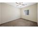 Cozy bedroom with ceiling fan and neutral carpet at 6713 Guidestar St, North Las Vegas, NV 89084