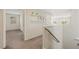 Hallway on upper level featuring white shelving with decor at 6713 Guidestar St, North Las Vegas, NV 89084